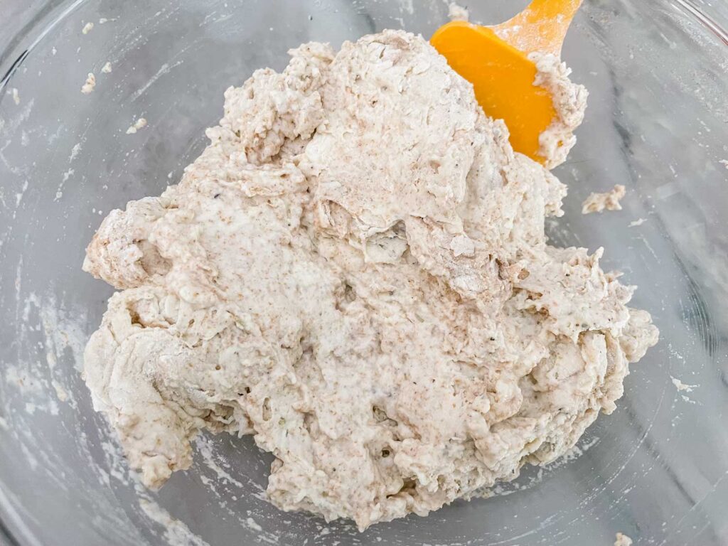 The dough after being mixed in a clear bowl
