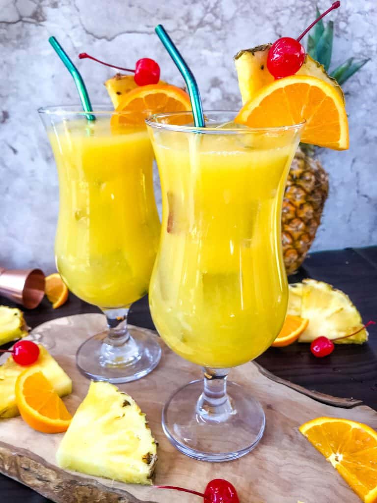 Copycat Olive Garden Tuscan Breeze Vodka Cocktail recipe. Pineapple, orange, and banana tropical alcoholic drink based on the restaurant favorite. A great summer cocktail. #copycatrecipes #vodkacocktail #tropicalcocktail