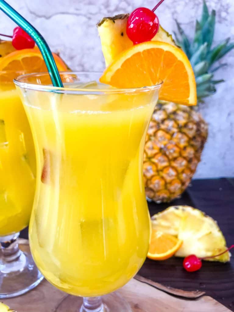 Copycat Olive Garden Tuscan Breeze Vodka Cocktail recipe. Pineapple, orange, and banana tropical alcoholic drink based on the restaurant favorite. A great summer cocktail. #copycatrecipes #vodkacocktail #tropicalcocktail