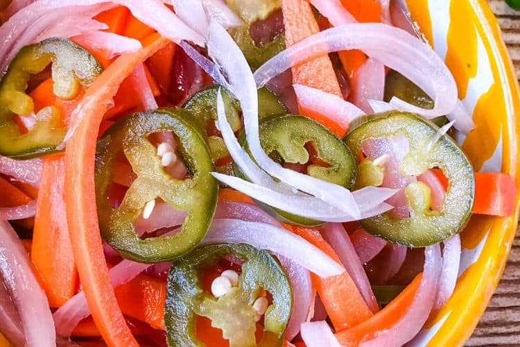 Top view of Escabeche (Mexican Pickled Vegetables) in a yellow bowl