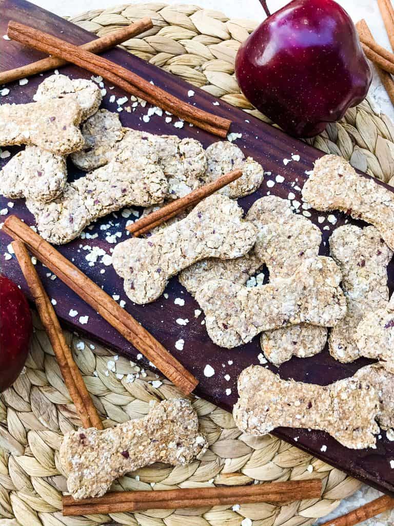 Oat Cinnamon Apple Dog Treats are full of simple ingredients in an easy homemade dog treat. These dog cookies are gluten free. Add flax seed if desired. #cinnamonapple #dogtreats #dogcookies