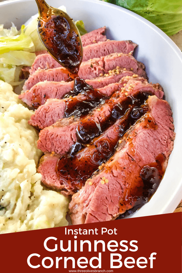 Instant Pot pin of Guinness Corned Beef with a spoon pouring Guinness glaze on top