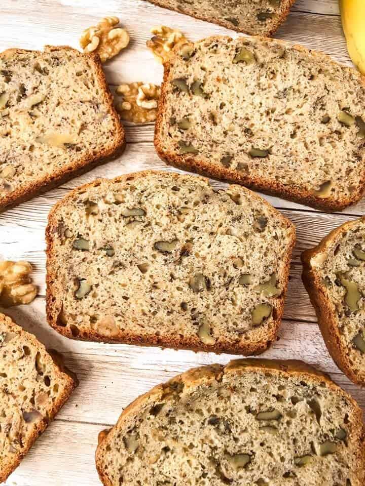 Slices of easy banana bread spread out on wood planks