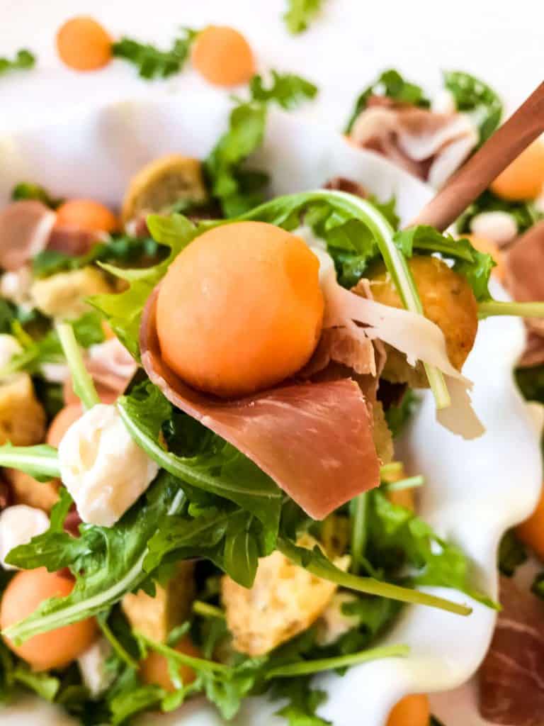 Spoon full of Prosciutto Melon Panzanella Salad