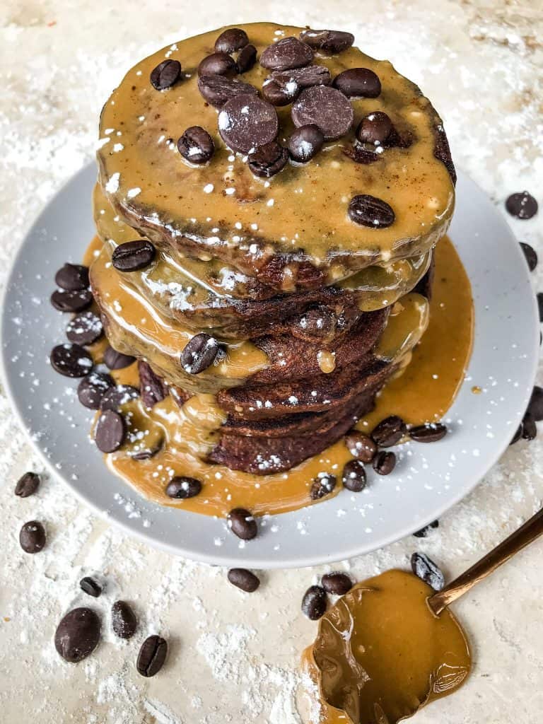Mocha Pancakes with Coffee Glaze is an easy homemade pancakes recipe filled with cocoa powder, coffee, and chocolate. A fun dessert breakfast or brunch. #homemadepancakes #chocolatepancakes #sweetpancakes