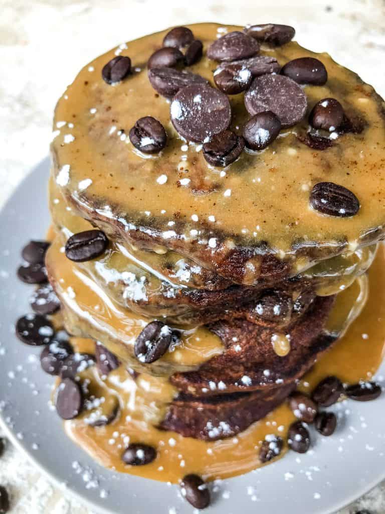 Mocha Pancakes with Coffee Glaze is an easy homemade pancakes recipe filled with cocoa powder, coffee, and chocolate. A fun dessert breakfast or brunch. #homemadepancakes #chocolatepancakes #sweetpancakes