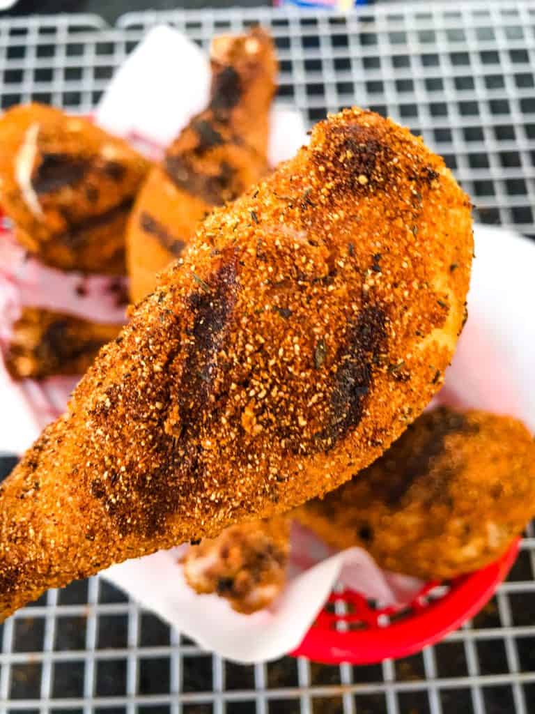 A close up of Dry Rub Cajun Grilled Chicken Drumstick with grill lines