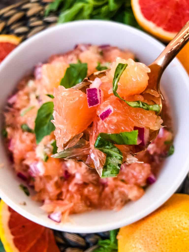 A copper spoon of grapefruit basil salsa