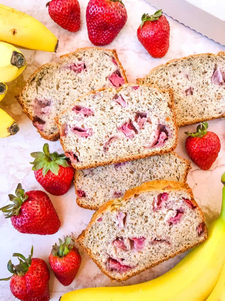 Slices of the quick bread surrounded by fruit