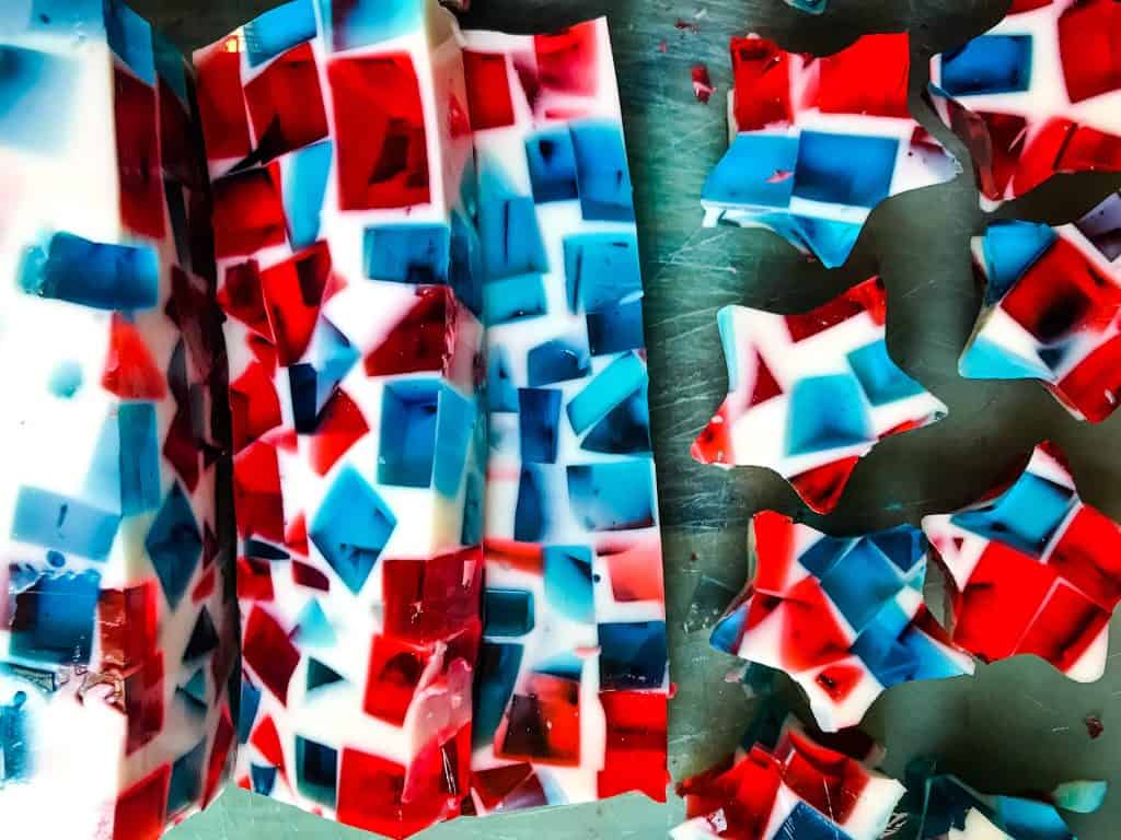 Slices of mosaic jello being cut into small stars