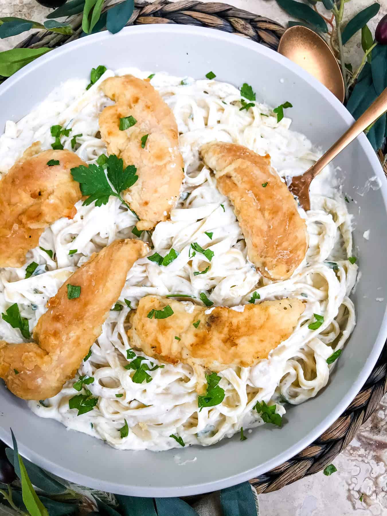 A dish full of Copycat Olive Garden Chicken Fettuccine Alfredo from the top view