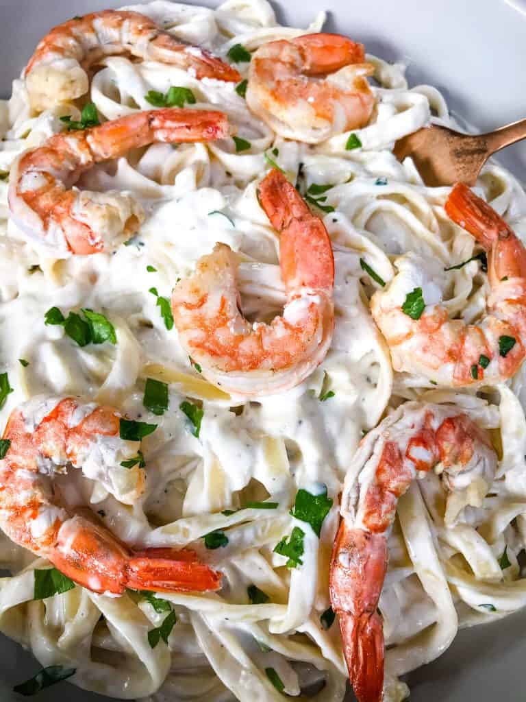 A bowl of creamy Copycat Olive Garden Shrimp Alfredo