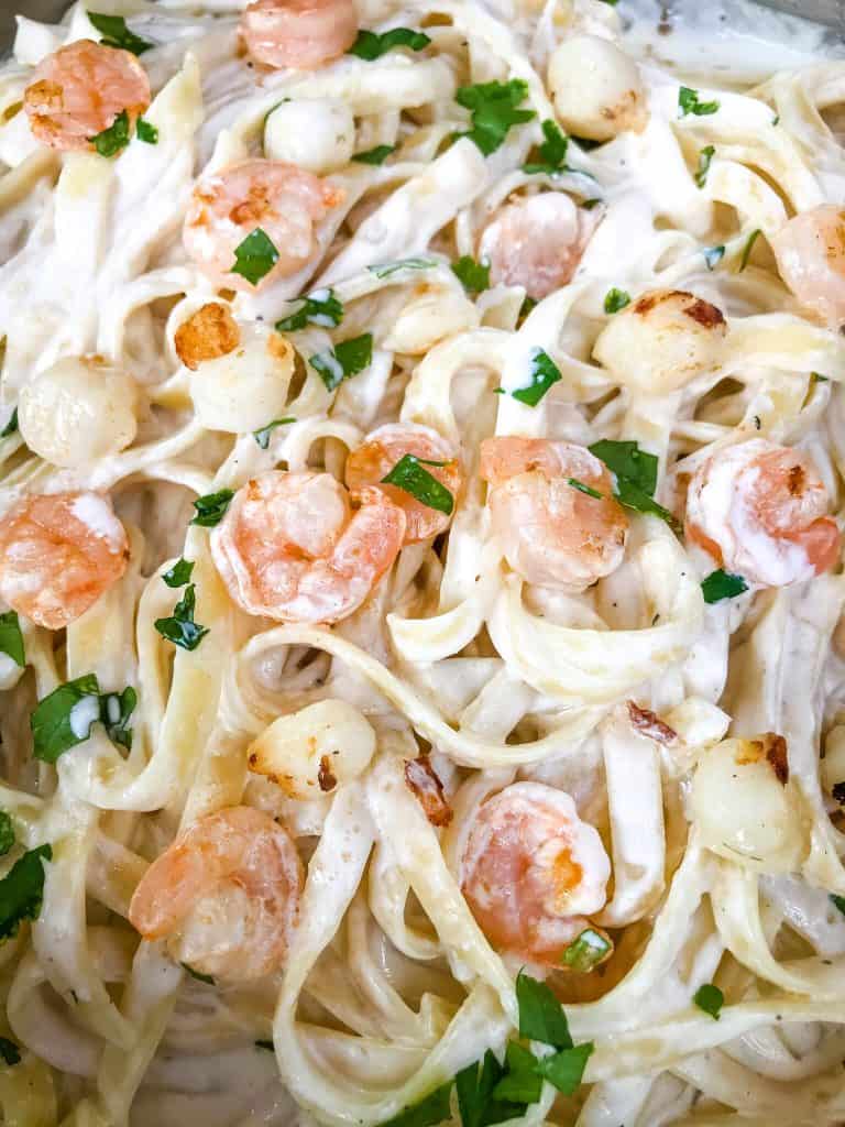 A close up of Copycat Olive Garden Seafood Alfredo pasta