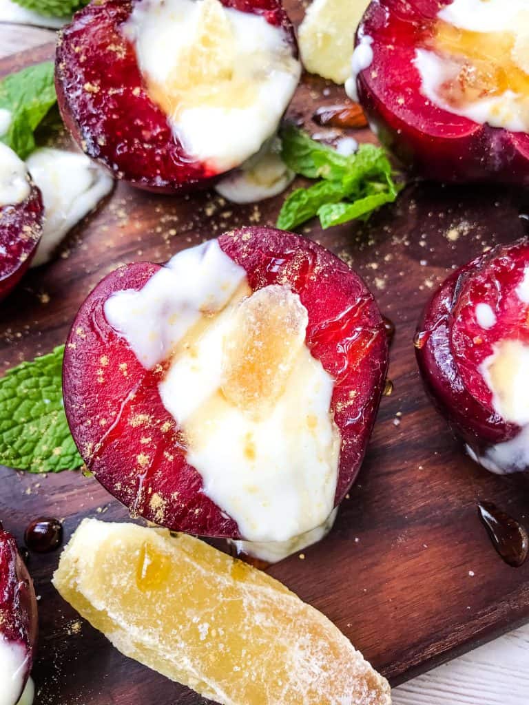 A close up of Grilled Plum Dessert with Ginger Honey Yogurt