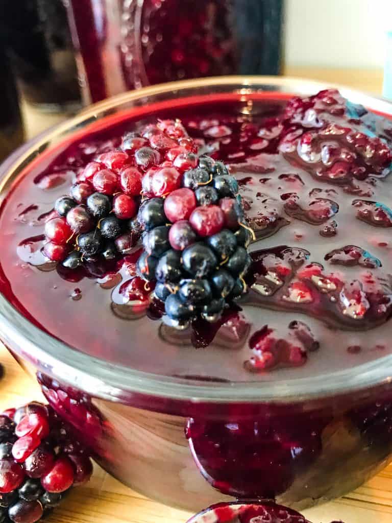 A close up of jam with berries in it