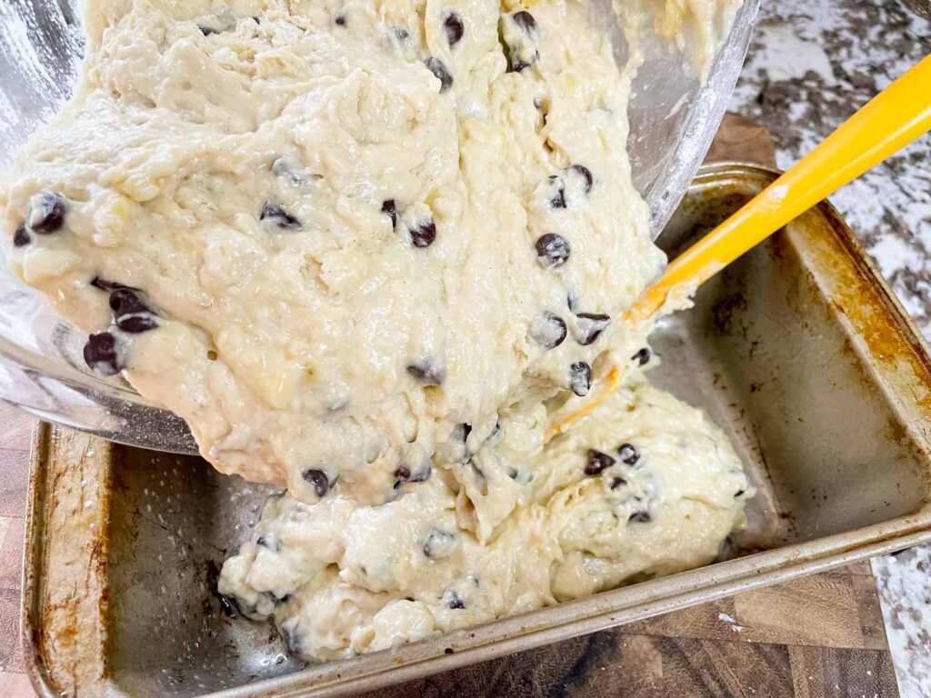 Pouring the batter into a bread loaf pan