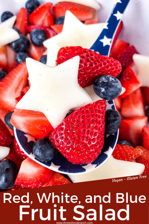 Pin image of a spoon of Patriotic Red, White, and Blue Fruit Salad with title at bottom