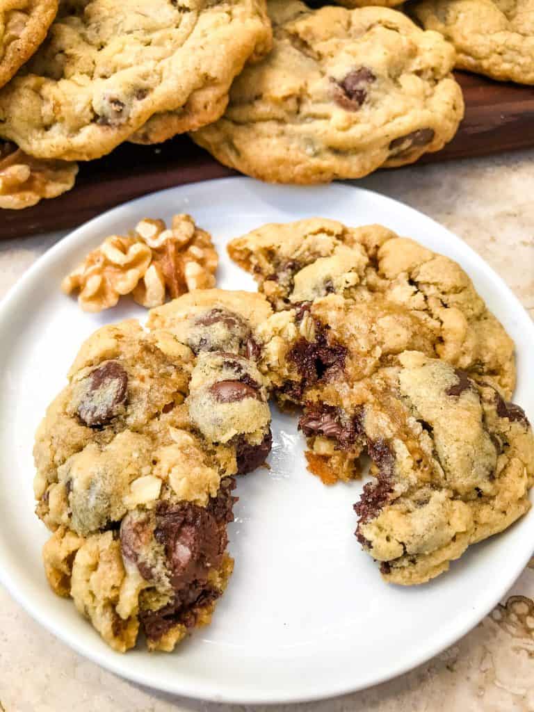 A plate with a cookie torn in half