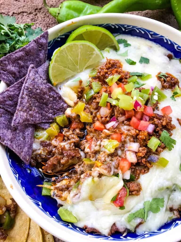 A close up of Hatch Green Chile Chorizo Queso Fundido partially eaten