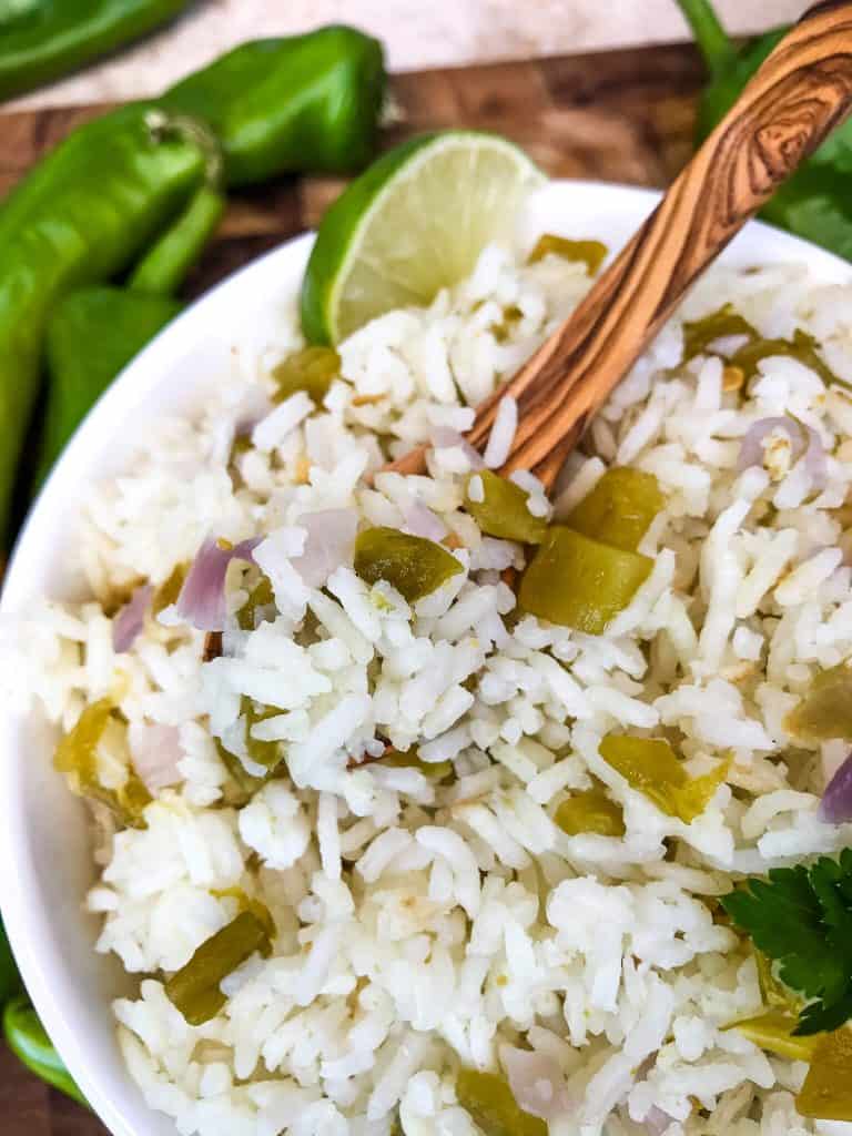 A bowl with a spoon scooping Hatch Green Chile Rice