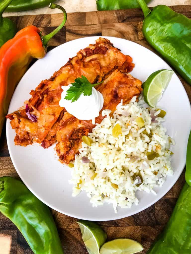 A plate with red enchiladas and Hatch Green Chile Rice