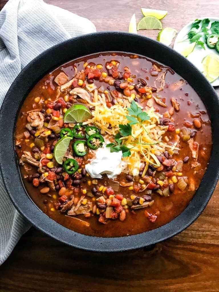 Large bowl of Chicken Taco Soup with toppings