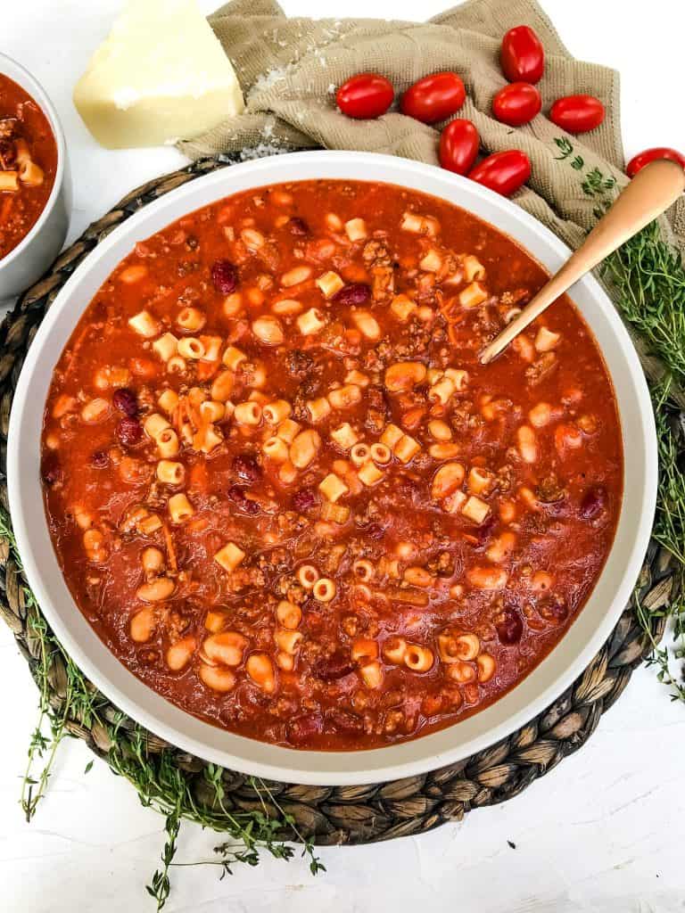 A large bowl of bean, pasta, and beef soup