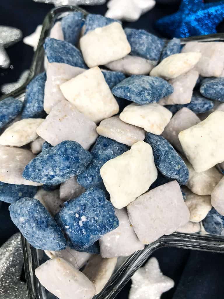 Blue, gray, and white muddy buddies in a star dish close up