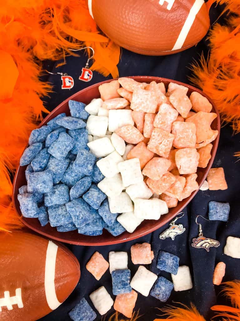 Blue, orange, and white muddy buddies separated in a football bowl