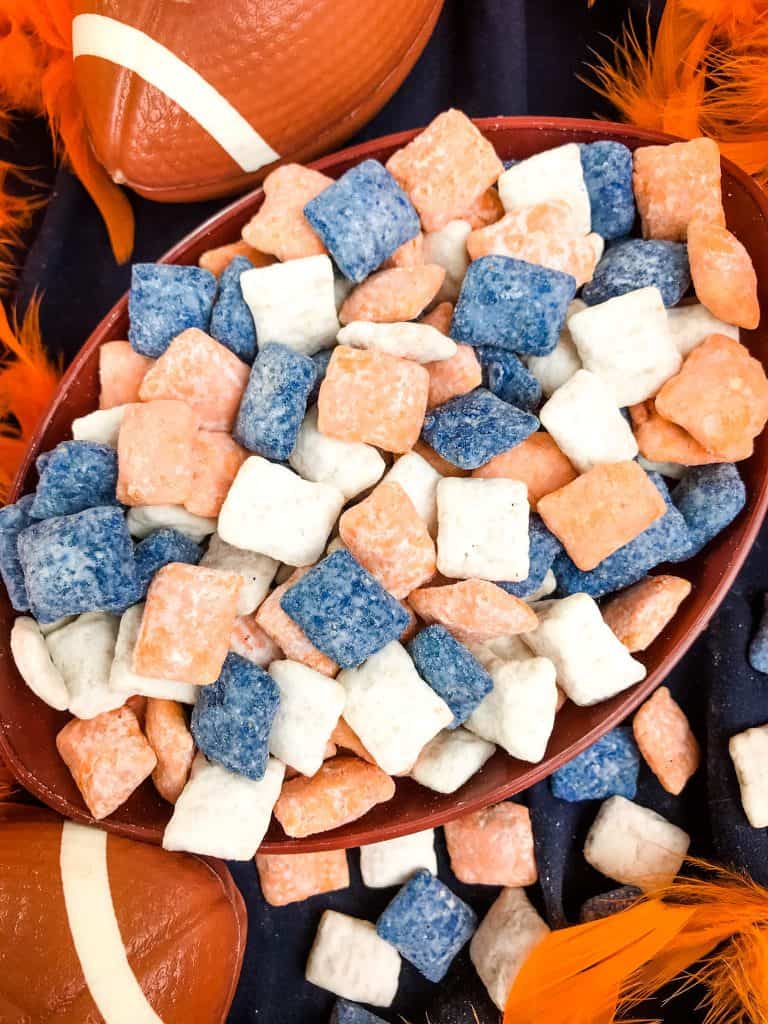 Close up of mixed Denver Broncos Puppy Chow