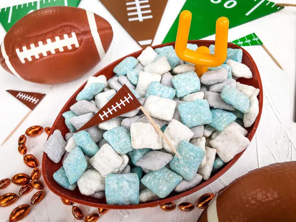 Detroit Lions Puppy Chow in a football bowl surrounded by football decorations