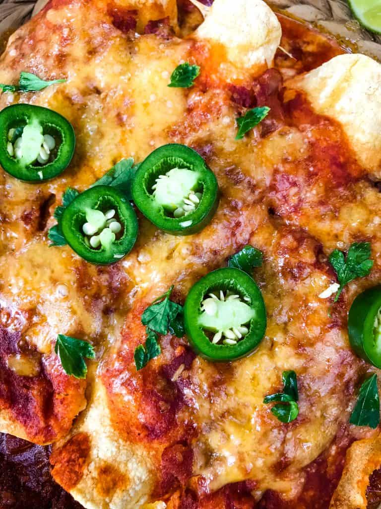 Close up of enchiladas with jalapeno slices