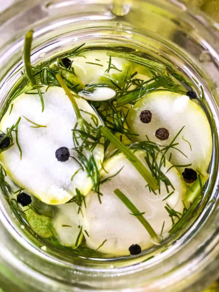 Close up of Homemade Peppercorn Dill Pickles in a jar