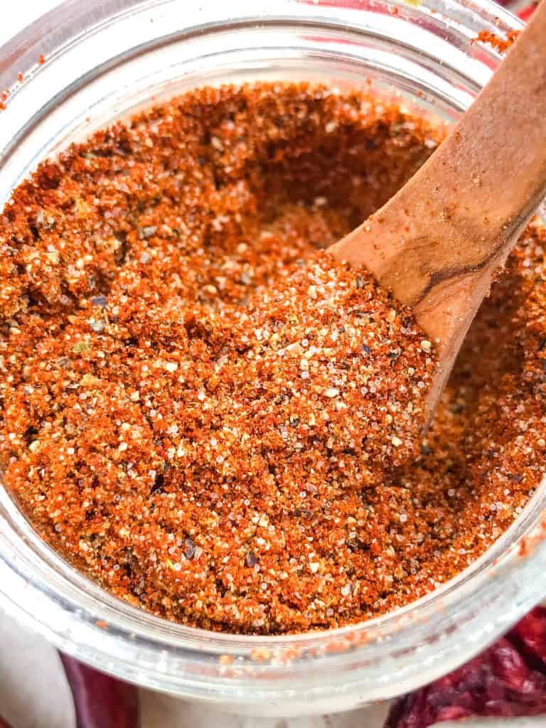 Top view of Homemade Taco Seasoning in a jar with a spoon