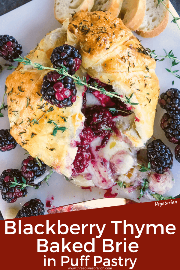 Pin image of a Thyme Blackberry Baked Brie in Puff Pastry cut open with cheese oozing out with title at bottom