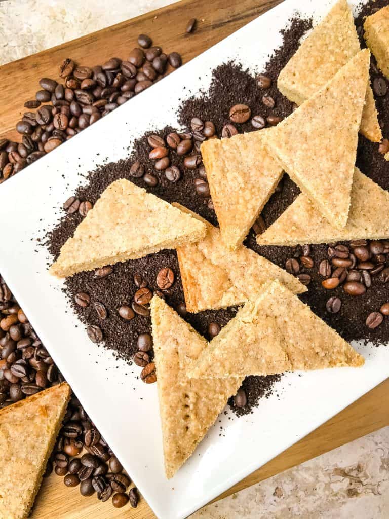 Coffee Shortbread Recipe on a plate with coffee grounds and beans