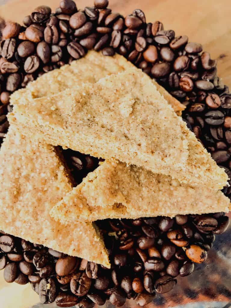 Cookies stacked on a pile of coffee beans