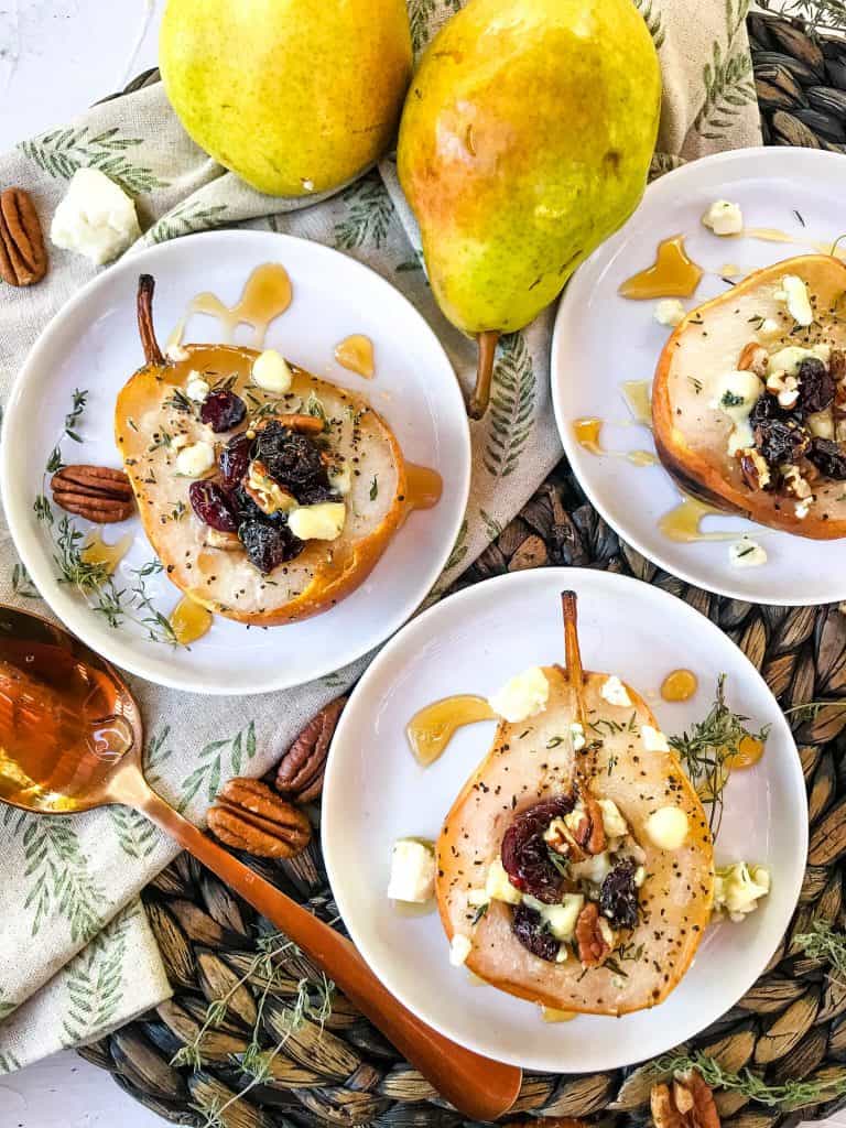 Savory Baked Pears with Gorgonzola, Walnuts, and Cranberries on three small plates