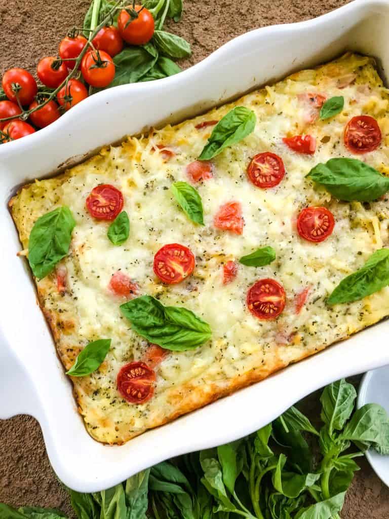 Caprese Hashbrown Breakfast Casserole in a white dish