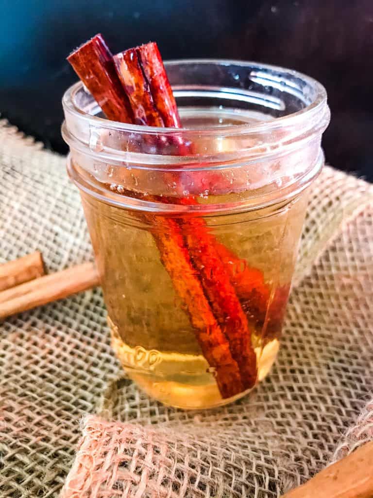 A clear jar with syrup