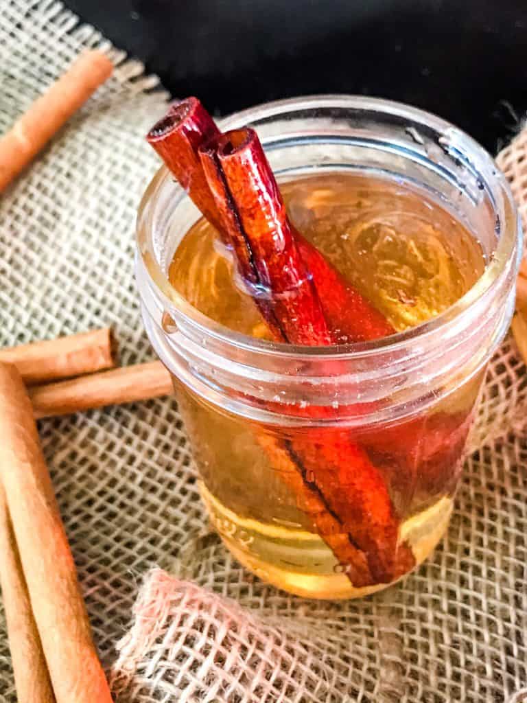 Cinnamon Simple Syrup in a glass jar with cinnamon sticks in it