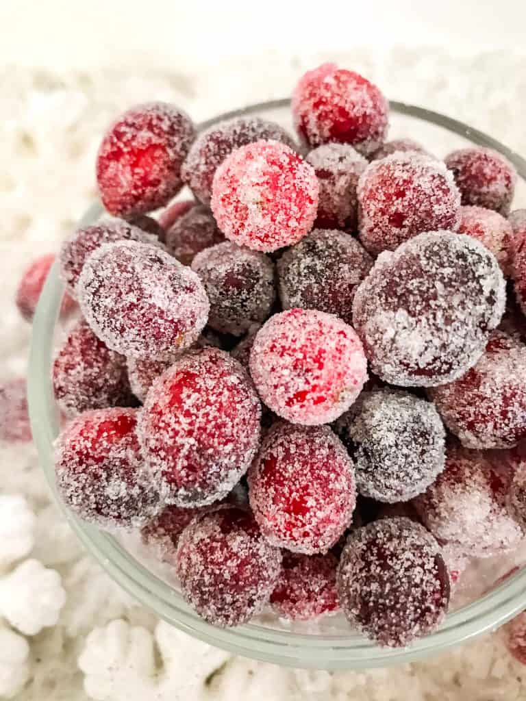 Berries covered in sugar in a bowl