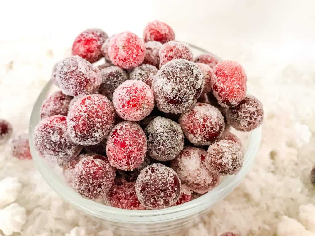 Sparkling Cranberries (Sugared Cranberries) in a bowl on snow