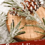 Pin image for Sparkling Rosemary (Sugared Rosemary) on a slice of wood with title at bottom