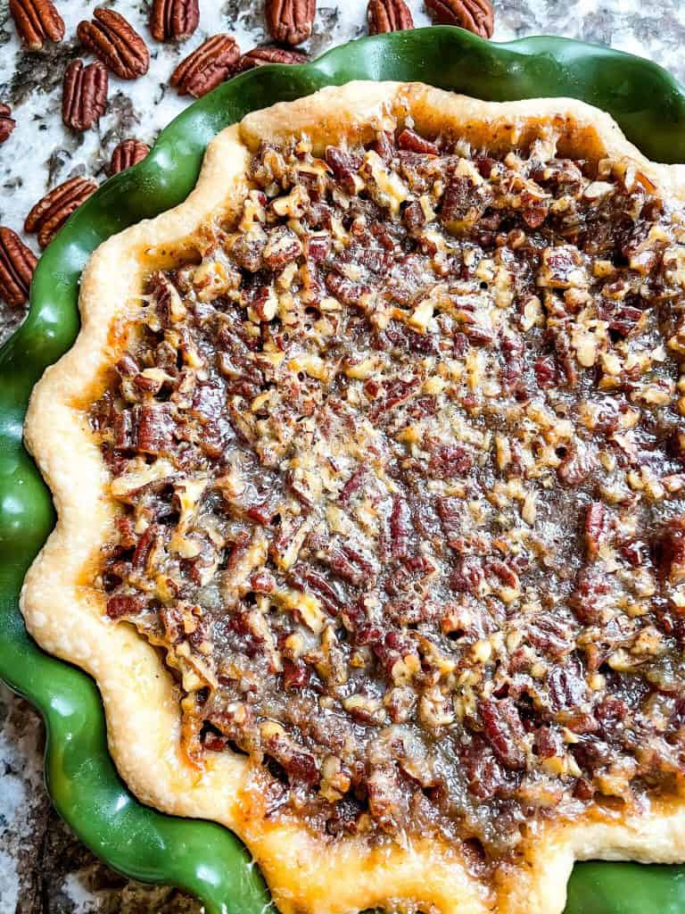 Close up top view of a cooked pecan pie