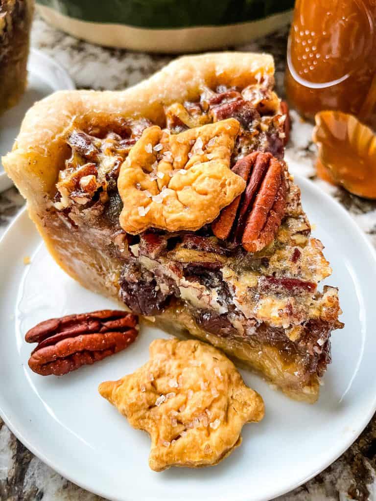 A slice of Chocolate Bourbon Pecan Pie on a small plate