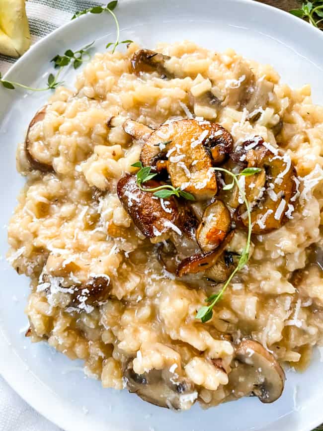 Close up of Creamy Mushroom Risotto from the top on a white plate