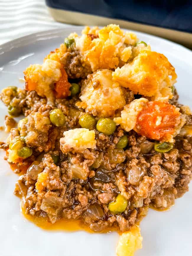 A pile of the cottage pie on a white plate