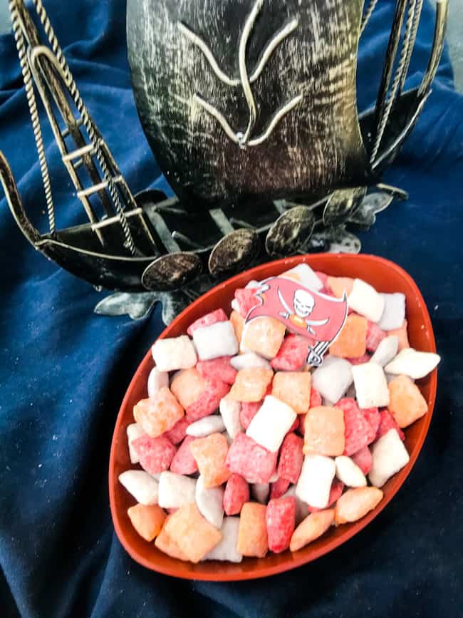 Tampa Bay Buccaneers Puppy Chow in a football bowl with a ship next to it