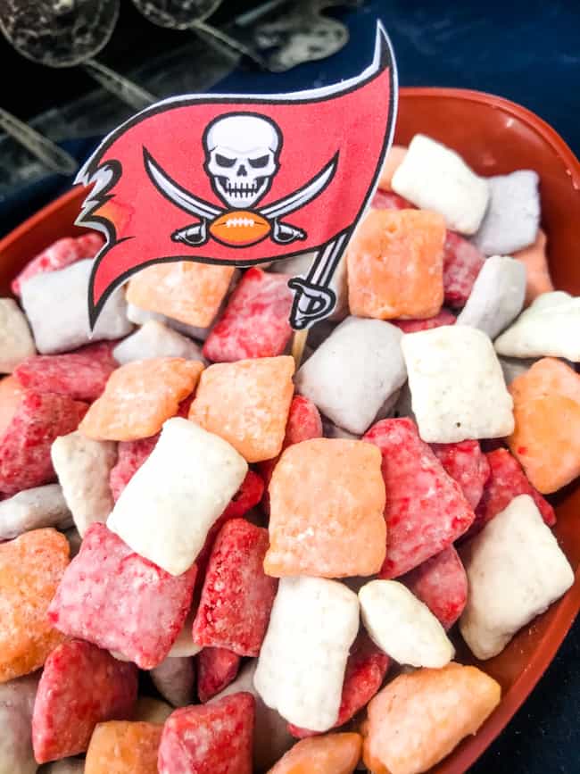 Tampa Bay Buccaneers Puppy Chow in a football shaped bowl with a little team flag